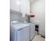 Laundry room with white washer and dryer, white cabinets, and tile floors at 263 Pelican Flight Dr, 15.4% Share, Dewees Island, SC 29451