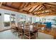 Open-concept space with dining area, living area, and access to a balcony, offering a relaxed atmosphere at 263 Pelican Flight Dr, 15.4% Share, Dewees Island, SC 29451