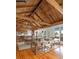 Expansive living space seamlessly combining a kitchen, dining area, and living area with a warm ambiance at 263 Pelican Flight Dr, 15.4% Share, Dewees Island, SC 29451