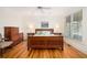 Spacious bedroom with hardwood floors, dresser and large windows at 263 Pelican Flight Dr, 15.4% Share, Dewees Island, SC 29451