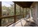 Relaxing screened porch with rocking chairs and wood flooring with natural views at 263 Pelican Flight Dr, 15.4% Share, Dewees Island, SC 29451