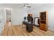 Spacious bedroom with hardwood floors, ceiling fan, and large mirror at 265 Grand Oaks Drive Dr, Ladson, SC 29456