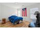 Bedroom with hardwood floors, natural light, and Puerto Rican flag at 265 Grand Oaks Drive Dr, Ladson, SC 29456