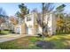 Inviting exterior view of a two-story home with a well-manicured lawn and mature trees at 265 Grand Oaks Drive Dr, Ladson, SC 29456