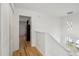 Bright hallway with hardwood floors, open doorway and staircase at 265 Grand Oaks Drive Dr, Ladson, SC 29456