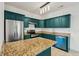 Modern kitchen featuring stainless steel appliances, granite countertops, and emerald green cabinets at 265 Grand Oaks Drive Dr, Ladson, SC 29456