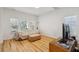 Bright and airy living room with hardwood floors and multiple windows at 265 Grand Oaks Drive Dr, Ladson, SC 29456
