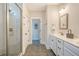 Bright bathroom with a glass-enclosed shower, double vanity, and neutral color palette at 2739 Calico Bass Ln, Johns Island, SC 29455