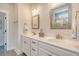 Bright bathroom featuring a double vanity with framed mirrors and ample counter space at 2739 Calico Bass Ln, Johns Island, SC 29455
