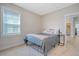 Cozy bedroom with natural light, neutral carpeting, and a modern metal bed frame at 2739 Calico Bass Ln, Johns Island, SC 29455
