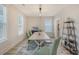 Dining room with large windows, wood table set, and rustic furnishings at 2739 Calico Bass Ln, Johns Island, SC 29455