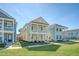 Charming two-story home with a welcoming front porch and beautifully landscaped front yard at 2739 Calico Bass Ln, Johns Island, SC 29455