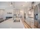 Kitchen with island featuring sink, seating and views into the living spaces at 2739 Calico Bass Ln, Johns Island, SC 29455
