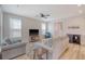 Spacious living room with comfortable seating, lots of natural light, and modern ceiling fan at 2739 Calico Bass Ln, Johns Island, SC 29455