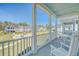 Inviting front porch with rocking chairs overlooking a common green space at 2739 Calico Bass Ln, Johns Island, SC 29455