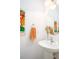 Bright bathroom featuring a modern sink, decorative art, and a round mirror at 275 Kelsey Blvd, Charleston, SC 29492