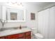 Updated bathroom features a marble vanity, framed mirror, and shower with curtain at 275 Kelsey Blvd, Charleston, SC 29492