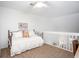 Bright upstairs bedroom featuring a lofted space, ceiling fan, and plush carpeting at 275 Kelsey Blvd, Charleston, SC 29492