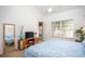 Bright bedroom featuring vaulted ceiling, window, a TV, and a full-length mirror at 275 Kelsey Blvd, Charleston, SC 29492