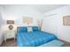Bedroom with ample natural light, bohemian-themed decor, and a blue accent bench at 275 Kelsey Blvd, Charleston, SC 29492