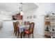 Bright dining room with chandelier, dining table set and connections to the kitchen and living area at 275 Kelsey Blvd, Charleston, SC 29492