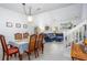 Open dining area with ample seating and views to the living room and natural light at 275 Kelsey Blvd, Charleston, SC 29492