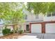 Charming townhome with brick accents, attached garages, and a well-maintained front yard and landscaping at 275 Kelsey Blvd, Charleston, SC 29492