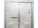 Clean shower features sliding glass doors, tiled surround, and built-in shelving at 275 Kelsey Blvd, Charleston, SC 29492