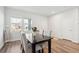 Bright dining area features a dark wood table and four upholstered chairs by a window at 284 Shadybrook Dr, Summerville, SC 29486