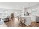 Open-concept kitchen with white cabinets, a center island with seating, and stainless steel appliances at 284 Shadybrook Dr, Summerville, SC 29486