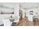 Eat-in kitchen area with stainless steel fridge, white cabinets, and a gray round table set at 284 Shadybrook Dr, Summerville, SC 29486