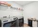 Laundry room equipped with modern washer and dryer units plus shelving, making chores a breeze at 284 Shadybrook Dr, Summerville, SC 29486