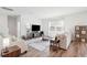 Cozy living room showcases hardwood floors, a plush sofa, a flat screen TV and natural light at 284 Shadybrook Dr, Summerville, SC 29486