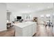 Bright open-concept living space featuring hardwood floors and seamless flow to the kitchen at 284 Shadybrook Dr, Summerville, SC 29486