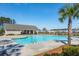 Inviting community pool with a lounge area, palm trees, and clubhouse in the background at 284 Shadybrook Dr, Summerville, SC 29486