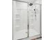 A modern shower features built-in shelves and a handheld sprayer, ideal for easy cleaning and accessibility at 284 Shadybrook Dr, Summerville, SC 29486