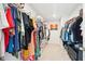 Organized walk-in closet with ample hanging space and shelving, perfect for efficient storage solutions at 284 Shadybrook Dr, Summerville, SC 29486