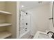 Bathroom featuring shower and tub combination with decorative shelving and modern fixtures at 2925 Alabama Dr, North Charleston, SC 29405