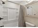Clean bathroom with shower, tub, and mirror with rustic frame at 2925 Alabama Dr, North Charleston, SC 29405