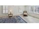 Bright living room with lots of light from plantation shutters, chaise lounge and decorative area rug at 2925 Alabama Dr, North Charleston, SC 29405