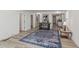 Bright and airy living room featuring light wood floors and a stylish blue rug at 2925 Alabama Dr, North Charleston, SC 29405