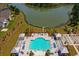 Aerial view of the community pool and recreational facilities with a view of the lake at 306 Long Pier St, Summerville, SC 29486