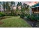 Well-manicured backyard with lush lawn, privacy fence, and mature landscaping at 306 Long Pier St, Summerville, SC 29486