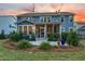 Home backyard with a patio and a lovely garden, perfect for outdoor living at 306 Long Pier St, Summerville, SC 29486