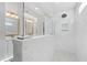 Modern bathroom with marble tile shower, frameless glass, and dual sink vanity at 306 Long Pier St, Summerville, SC 29486