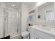 Bright bathroom with white cabinets, shower with glass door, and modern fixtures at 306 Long Pier St, Summerville, SC 29486