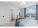 Comfortable bedroom with natural light, view of a backyard, and stylish decor at 306 Long Pier St, Summerville, SC 29486