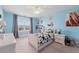 Bright bedroom with large window, ceiling fan, and playful decor at 306 Long Pier St, Summerville, SC 29486