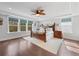 Bright bedroom featuring a wooden bed, ceiling fan, natural light, and classic decor at 306 Long Pier St, Summerville, SC 29486