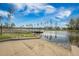 Beautiful waterfront view from a concrete boat ramp looking out onto a tranquil lake, surrounded by neighborhood homes at 306 Long Pier St, Summerville, SC 29486